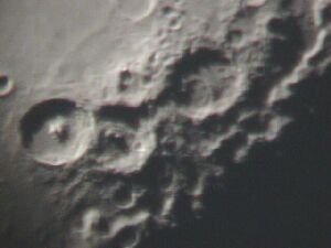 Craters on the moon, going through the scope & using the cameras zoom feature.